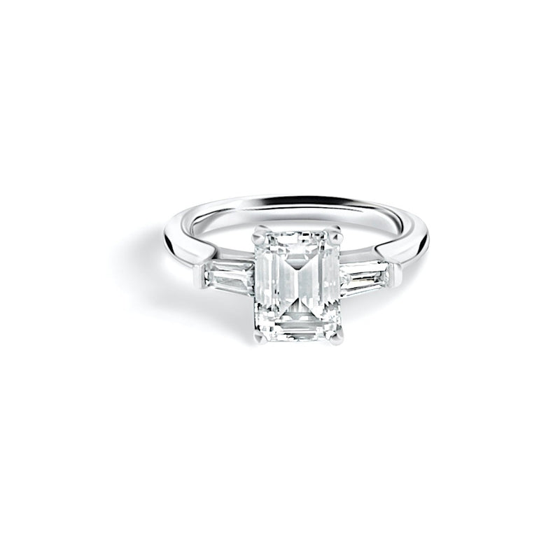 Emerald cut engagement ring with trapeze diamonds